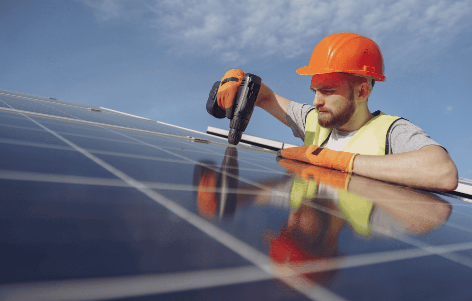Man Installing Solar Panels - Specialist Accounting Solutions